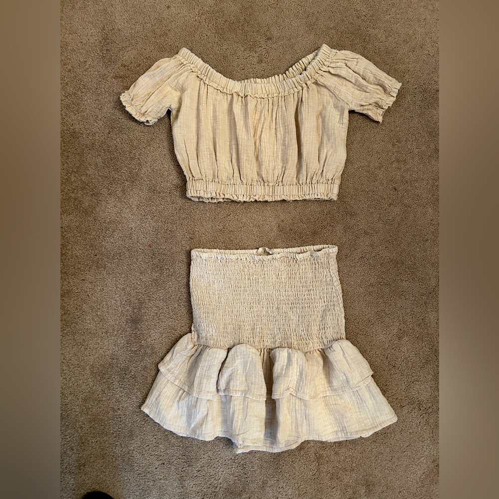 Woman’s tan skirt set size medium.